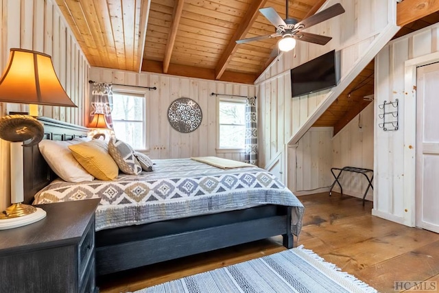 bedroom featuring wood ceiling, wood-type flooring, vaulted ceiling with beams, wooden walls, and ceiling fan