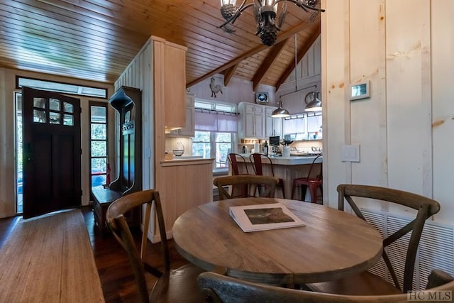 dining room with beam ceiling, wood ceiling, an inviting chandelier, high vaulted ceiling, and dark hardwood / wood-style floors