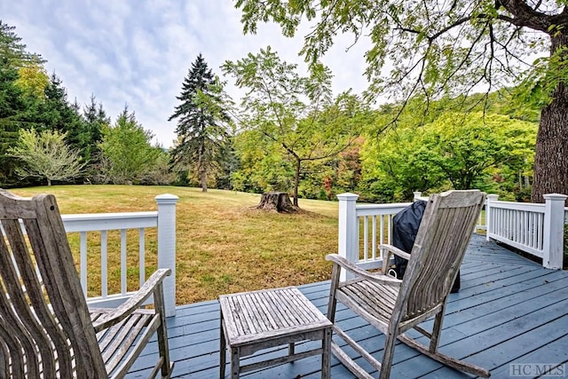 wooden deck with a lawn