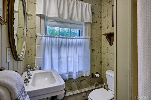 bathroom featuring sink and toilet