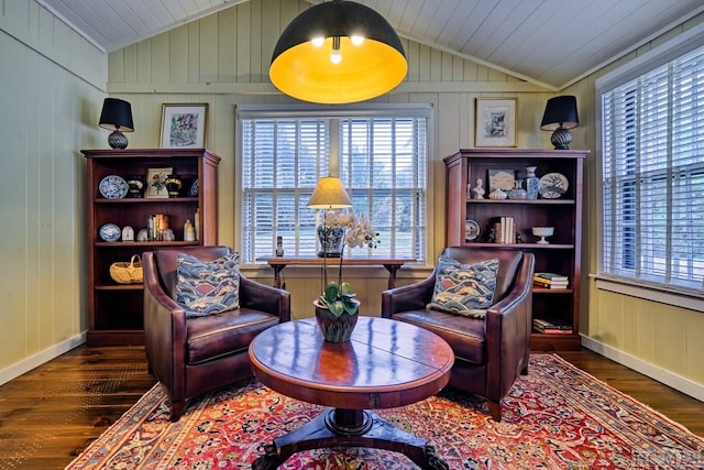 sitting room with lofted ceiling and dark hardwood / wood-style floors