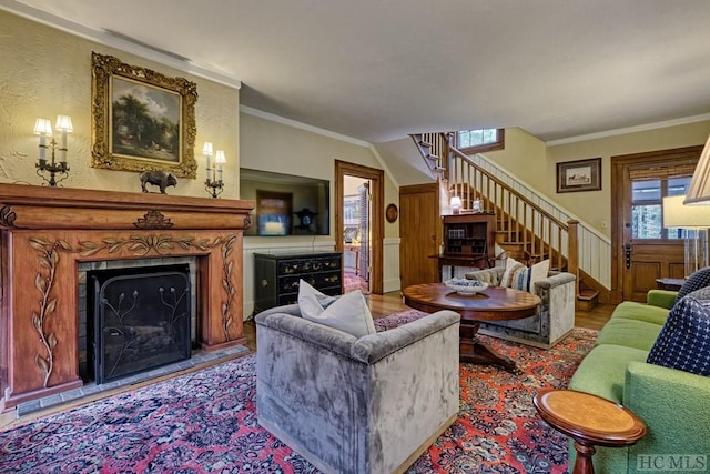 living room featuring ornamental molding and light wood-type flooring