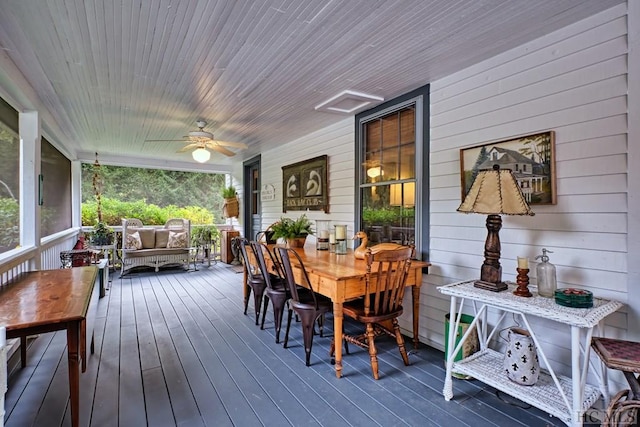 wooden deck featuring ceiling fan