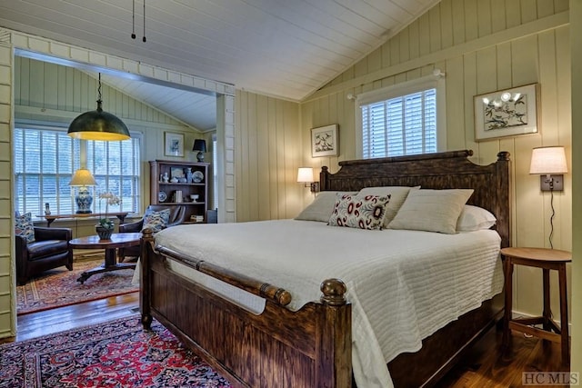 bedroom featuring lofted ceiling and hardwood / wood-style flooring