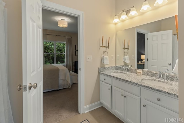 bathroom with vanity and tile patterned flooring