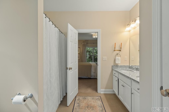 bathroom with tile patterned flooring and vanity