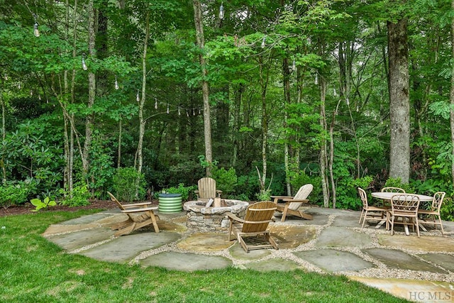 view of patio featuring an outdoor fire pit