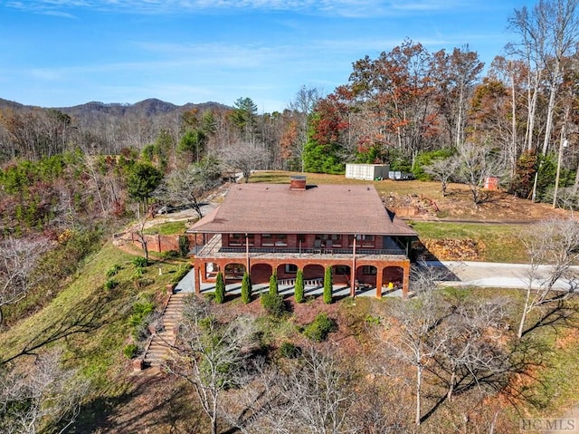 birds eye view of property with a mountain view