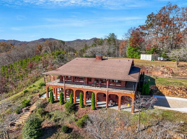 380 Ledford Dr, Franklin, NC 28734 - back of property featuring a chimney, a balcony, and a mountain view