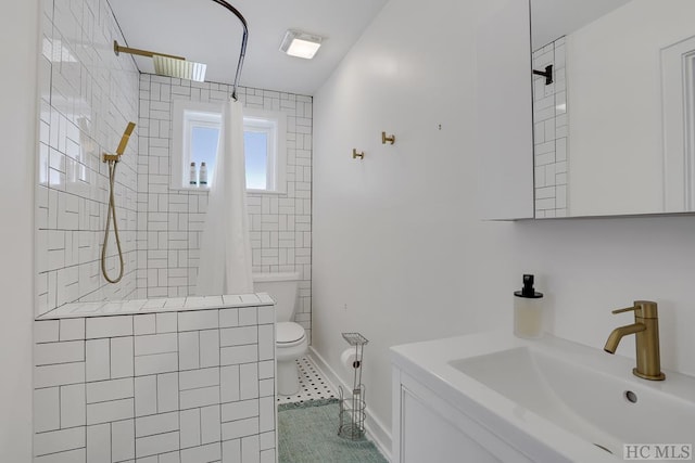 bathroom featuring tile patterned floors, sink, curtained shower, and toilet