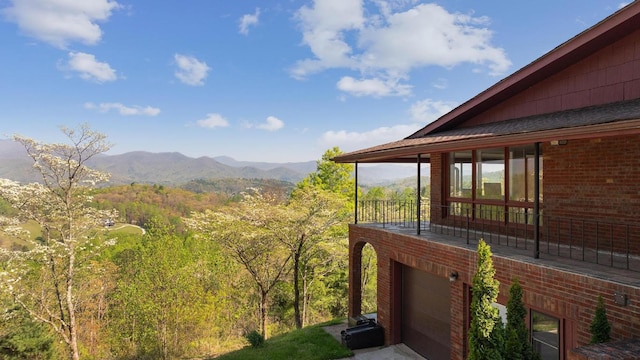 380 Ledford Dr, Franklin, NC 28734 - exterior space with a garage, brick siding, a wooded view, and a mountain view