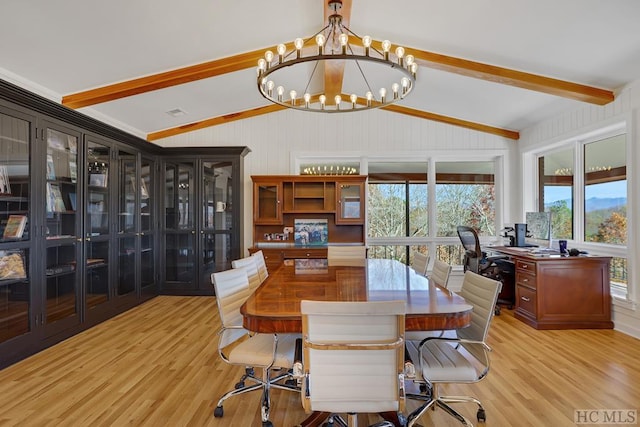 dining area with light hardwood / wood-style floors, lofted ceiling with beams, and a notable chandelier