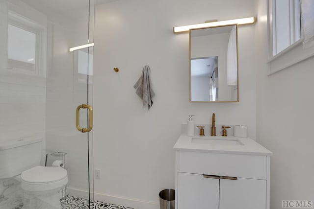 bathroom featuring vanity, an enclosed shower, and toilet