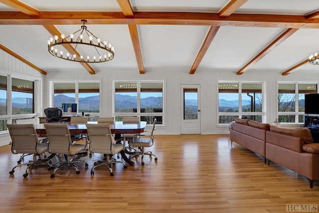 380 Ledford Dr, Franklin, NC 28734 - living room with a tile fireplace, wood finished floors, visible vents, vaulted ceiling with beams, and a chandelier