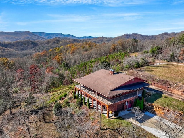 birds eye view of property with a mountain view