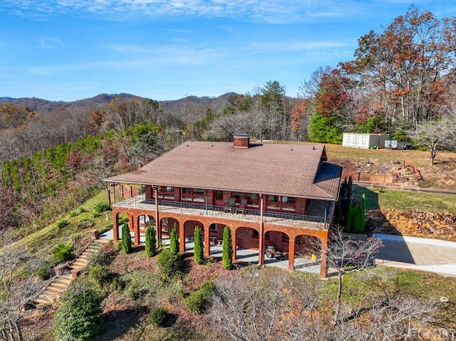 view of front of property with a mountain view