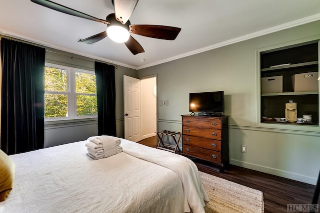 bedroom featuring crown molding, ceiling fan, and dark hardwood / wood-style floors