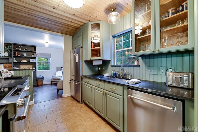 kitchen featuring appliances with stainless steel finishes, sink, light tile patterned floors, and wooden ceiling