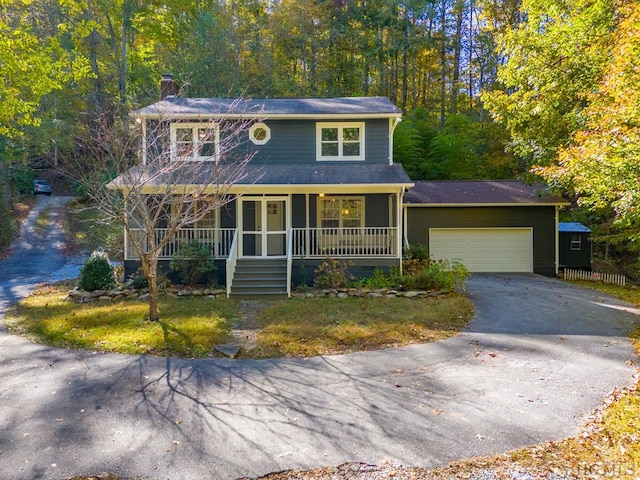 view of front of house with a porch and a garage