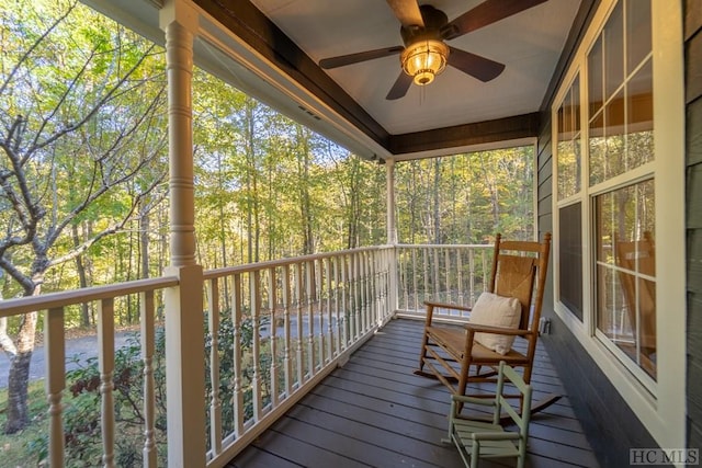 wooden deck featuring ceiling fan and a porch