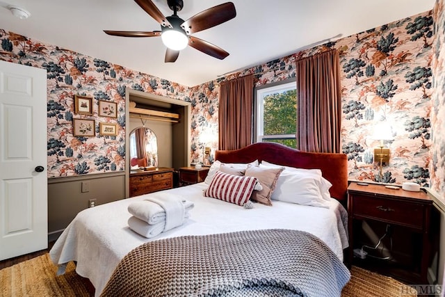 bedroom with ceiling fan and hardwood / wood-style floors