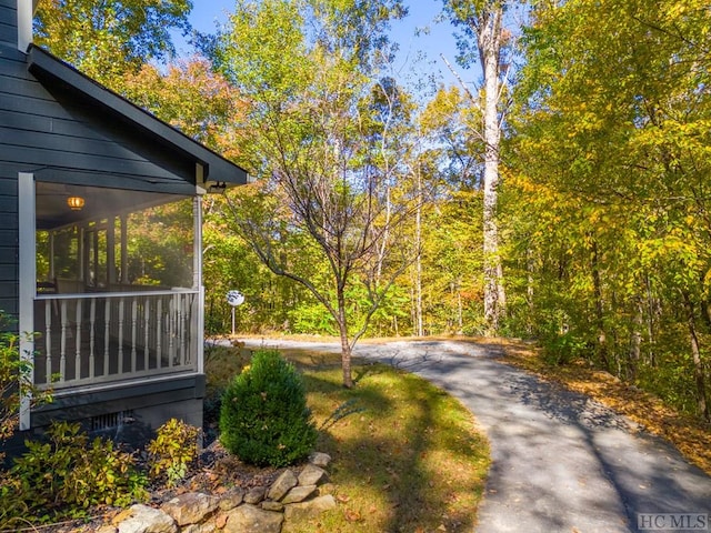 view of yard with a sunroom