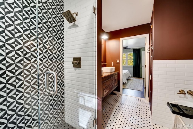 bathroom with sink and a shower with shower door