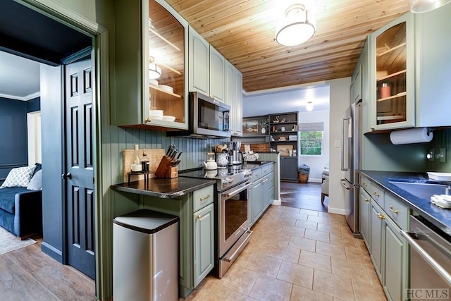 kitchen with wood ceiling, crown molding, light tile patterned floors, stainless steel appliances, and decorative backsplash