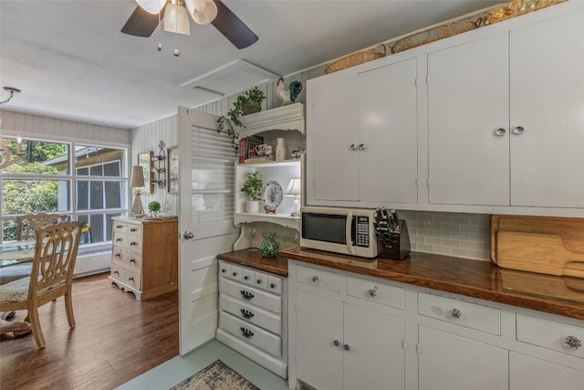 70 Rolling Acres Dr, Highlands, NC 28741 - kitchen featuring stainless steel microwave, open shelves, backsplash, ceiling fan, and white cabinetry