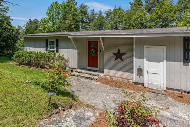 70 Rolling Acres Dr, Highlands, NC 28741 - view of front of house with a front lawn and brick siding