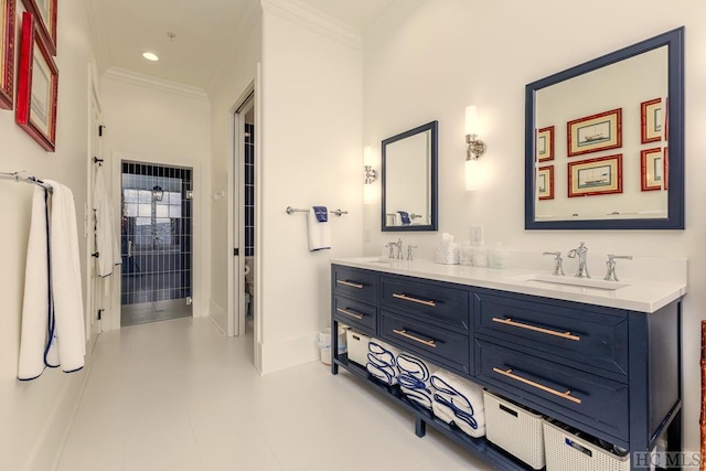 bathroom featuring vanity, ornamental molding, and toilet