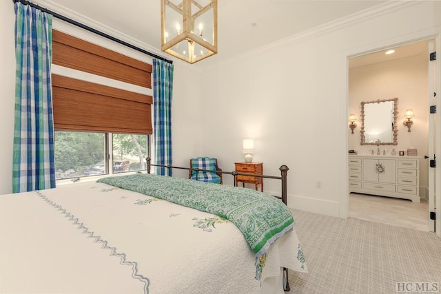 bedroom with connected bathroom, ornamental molding, a chandelier, and carpet flooring