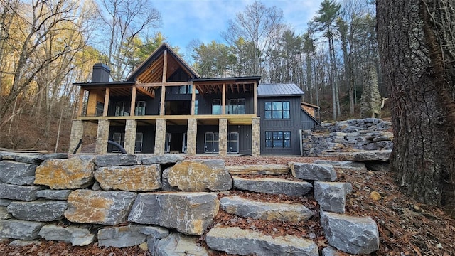 back of property with a balcony