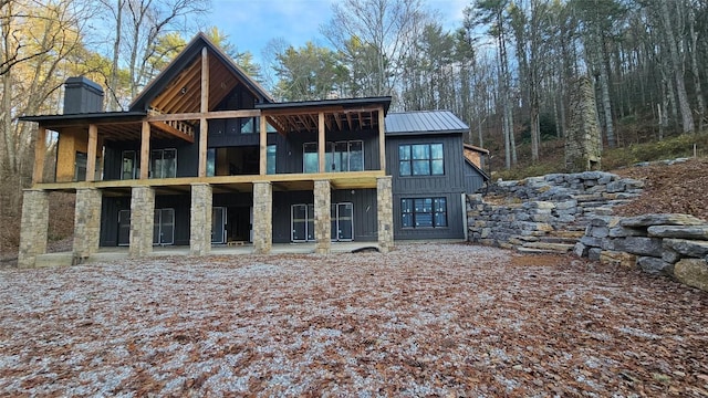 back of property featuring a balcony