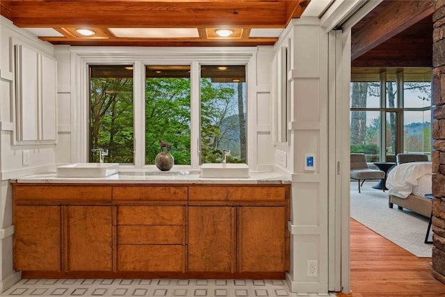 749 Stillmont Cir, Cashiers, NC 28717 - bathroom featuring beamed ceiling, a sink, and wood finished floors