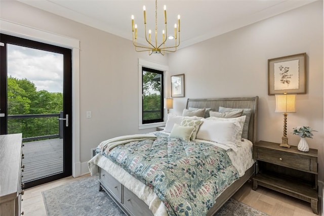 227 Sherwood Forest Rd, Highlands, NC 28741 - bedroom with access to exterior, a chandelier, and light wood-style floors