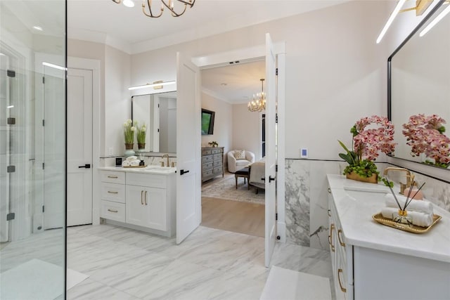 227 Sherwood Forest Rd, Highlands, NC 28741 - bathroom featuring a chandelier, crown molding, vanity, a shower stall, and a wainscoted wall