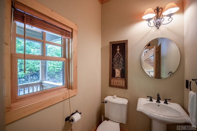 bathroom featuring sink and toilet