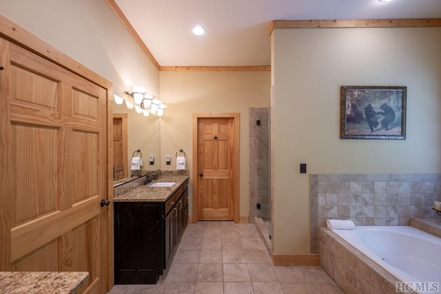 bathroom featuring vanity, crown molding, plus walk in shower, and tile patterned flooring