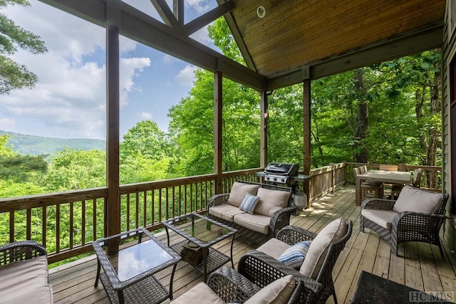 sunroom / solarium featuring wooden ceiling and lofted ceiling