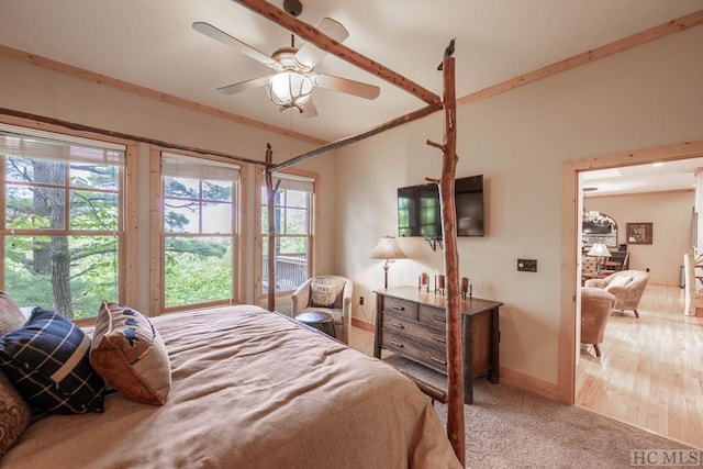 bedroom featuring light carpet and ceiling fan