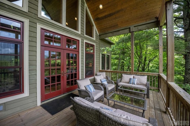 wooden terrace featuring an outdoor hangout area and french doors