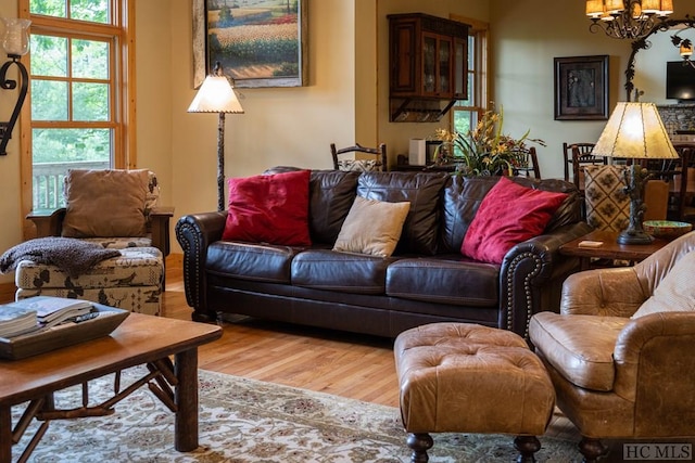 living room featuring hardwood / wood-style floors and a chandelier