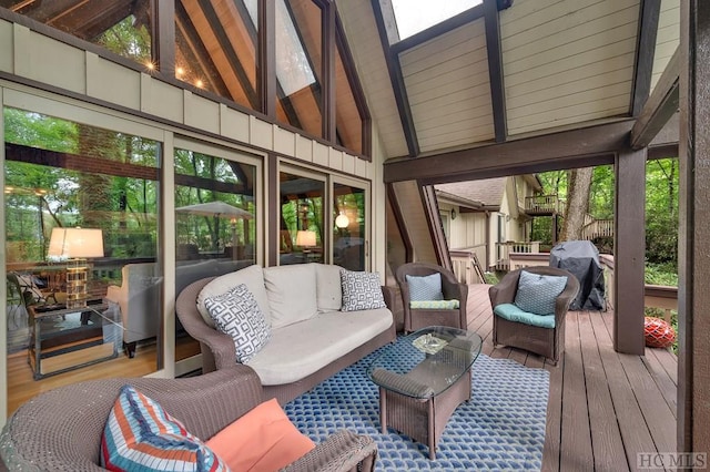 sunroom with lofted ceiling with beams