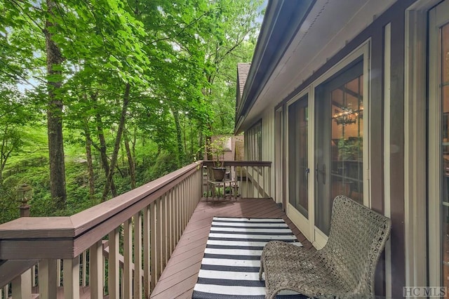 wooden balcony featuring a deck