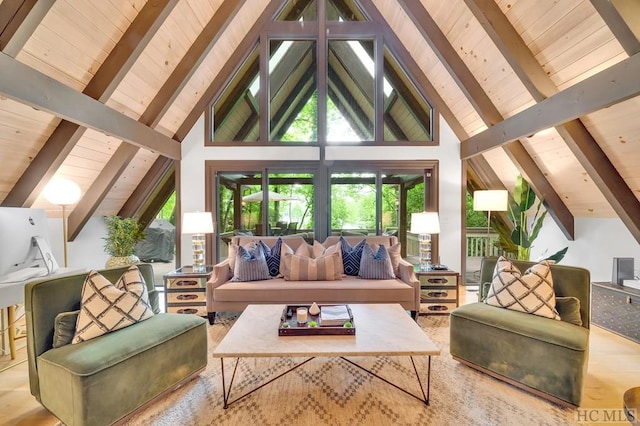 living room with beam ceiling, wood-type flooring, and a healthy amount of sunlight