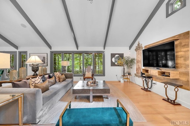 living room featuring hardwood / wood-style flooring and vaulted ceiling with beams