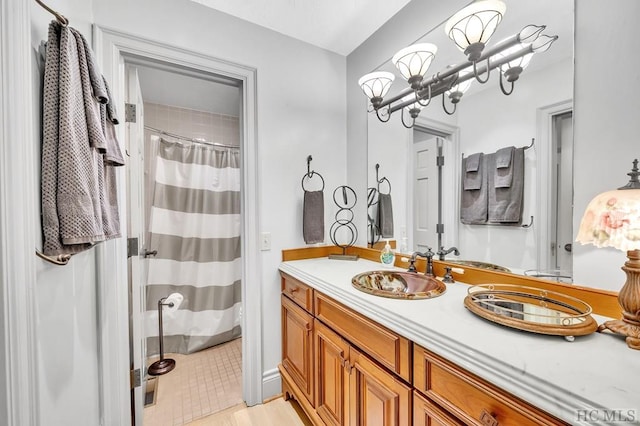 bathroom with vanity, walk in shower, and a chandelier