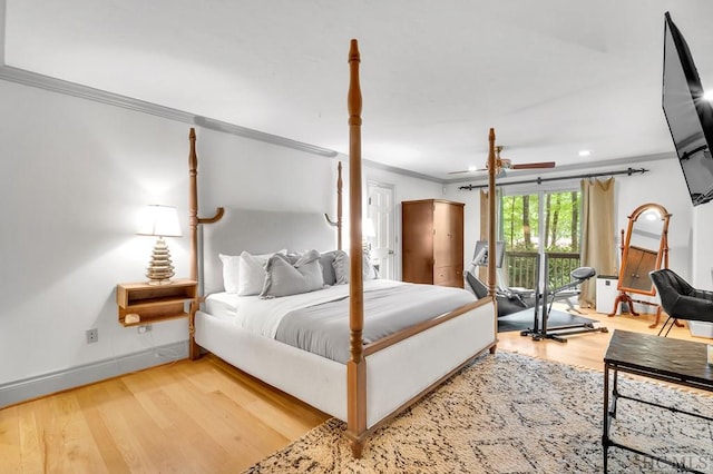 bedroom with wood-type flooring and crown molding