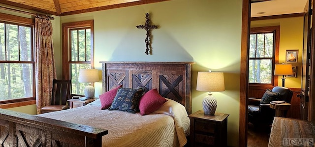 bedroom with lofted ceiling and wood ceiling